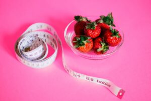 strawberries and measuring tape